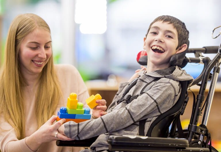 Care worker supporting a child at home